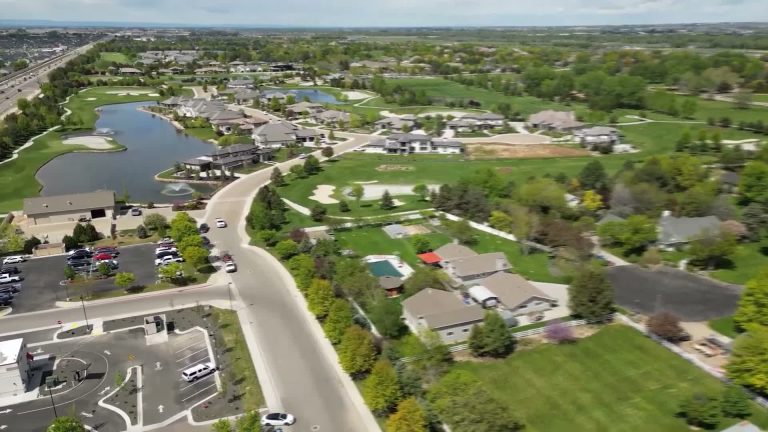Aerial view over part of the SpurWing area in North Meridian showing golf holes, water, homes, and the Chinden corridor